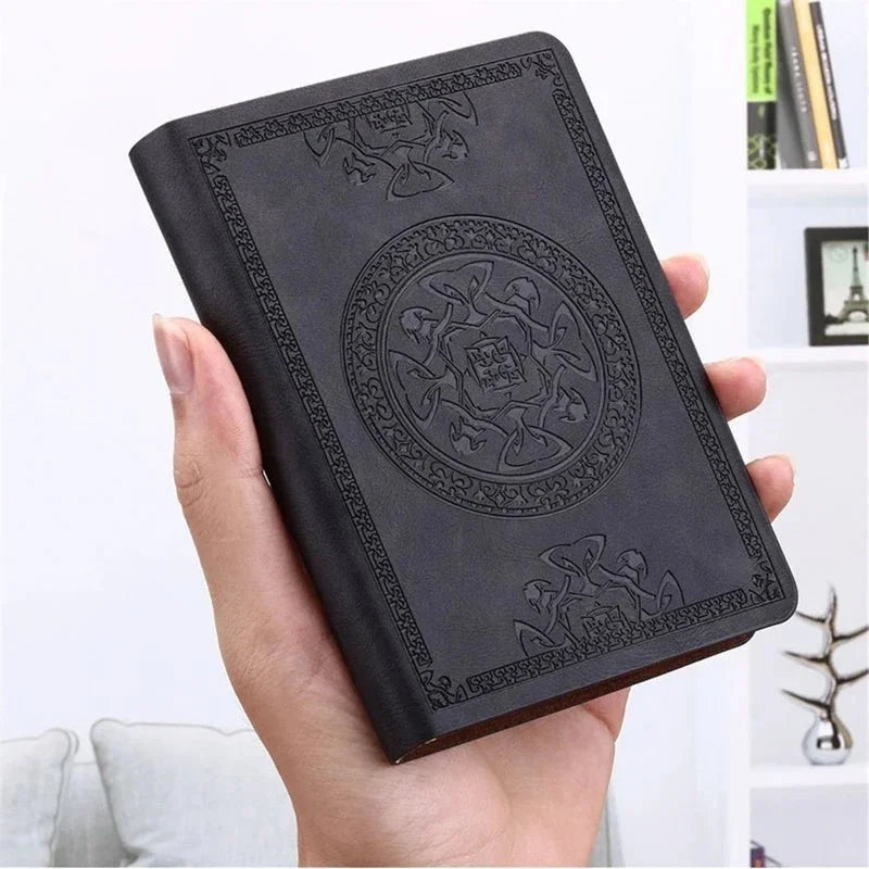 Black A6 Vintage Pocket Notebook held in one hand